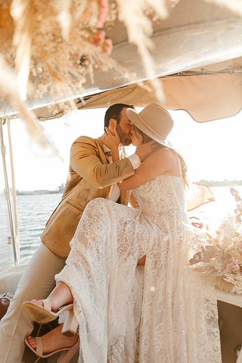  1970s golden hour boat elopement – in boat 