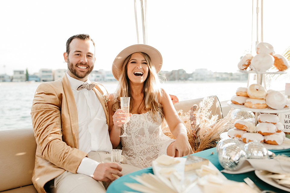  1970s golden hour boat elopement – couple on boat 