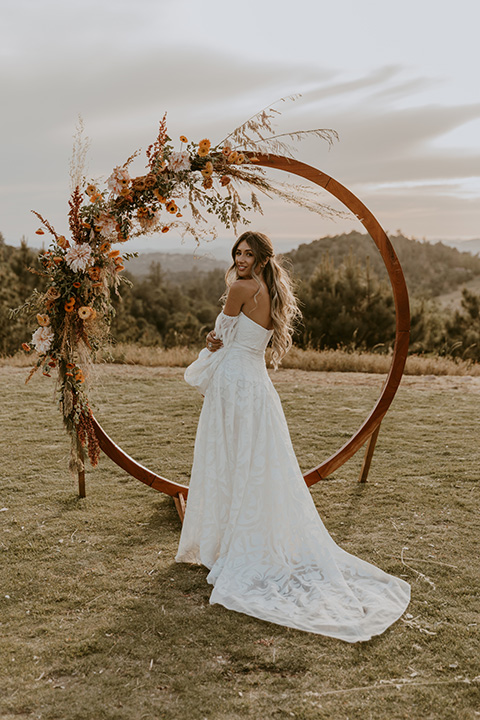  bride in a rue de sine gown and boho wide brimmed hat  