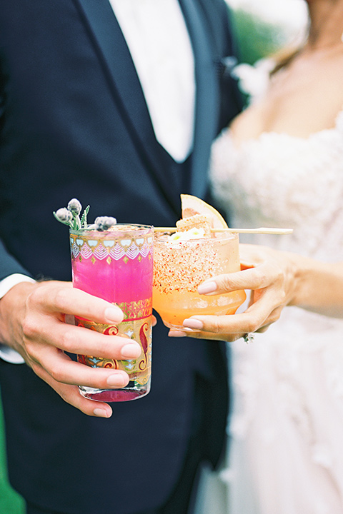  black tie wedding with a sting light reception and the bride in a modern ballgown and the groom in a black tuxedo 