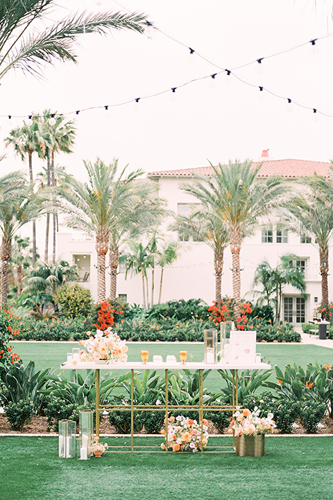  black tie wedding with a sting light reception and the bride in a modern ballgown and the groom in a black tuxedo 