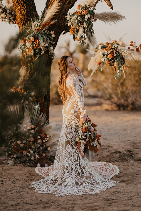  bohemian bride in a rue de sine gown and the groom in a caramel suit