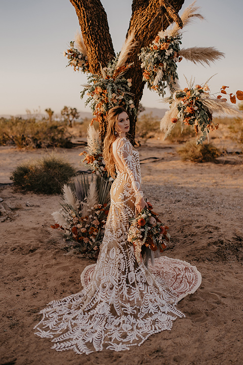  bohemian bride in a rue de sine gown and the groom in a caramel suit 