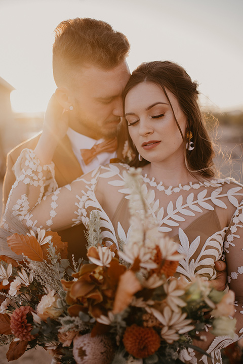  bohemian bride in a rue de sine gown and the groom in a caramel suit