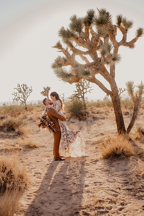  bohemian bride in a rue de sine gown and the groom in a caramel suit