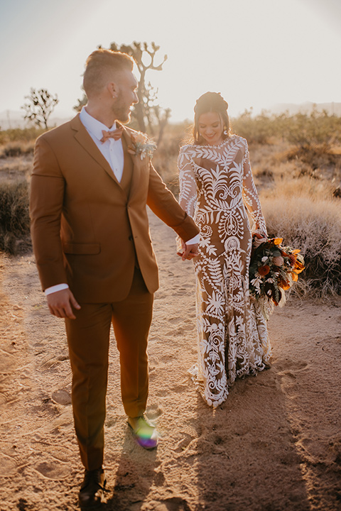  bohemian bride in a rue de sine gown and the groom in a caramel suit