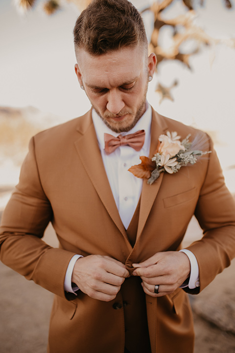  bohemian bride in a rue de sine gown and the groom in a caramel suit