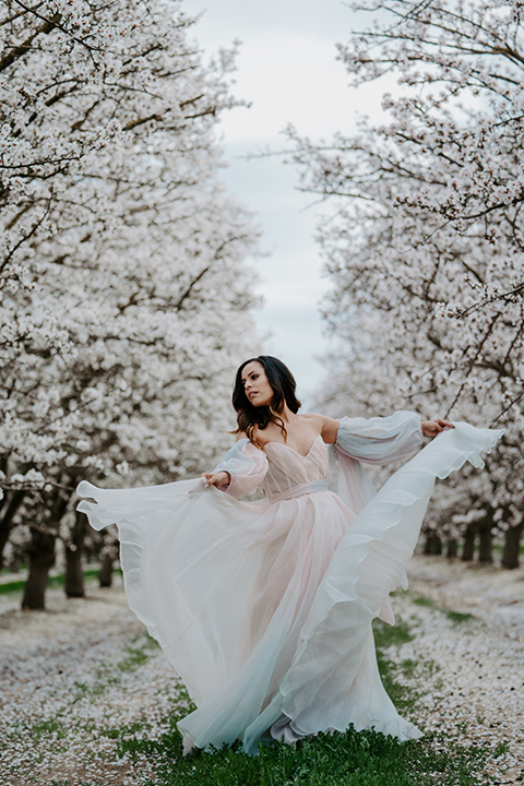  bride in a pastel pink and blue gown 