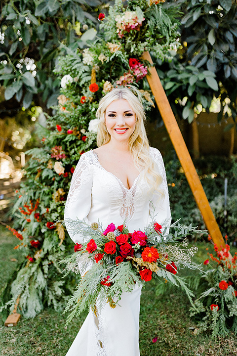  Christmas styled shoot with the bride in a formfitting gown with long sleeves 