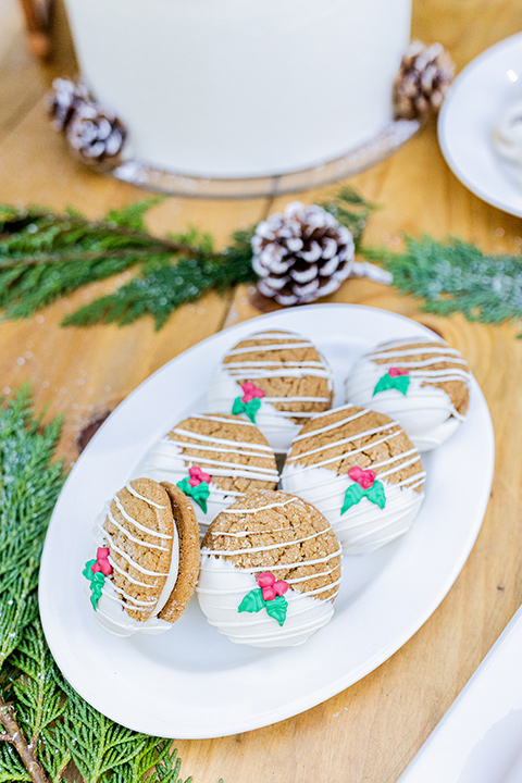  Christmas styled shoot with a white tiered cake and pinecone decor 
