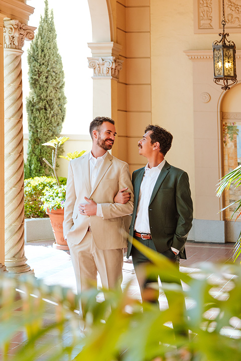  engagement shoot in long beach CA with one groom in a tan suit and the other groom in a green suit