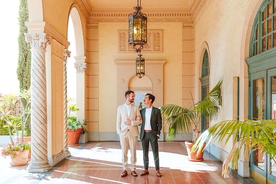  engagement shoot in long beach CA with one groom in a tan suit and the other groom in a green suit