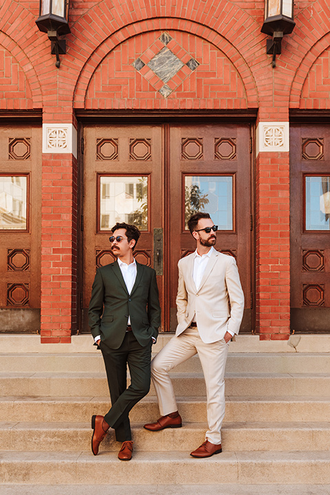  engagement shoot in long beach CA with one groom in a tan suit and the other groom in a green suit