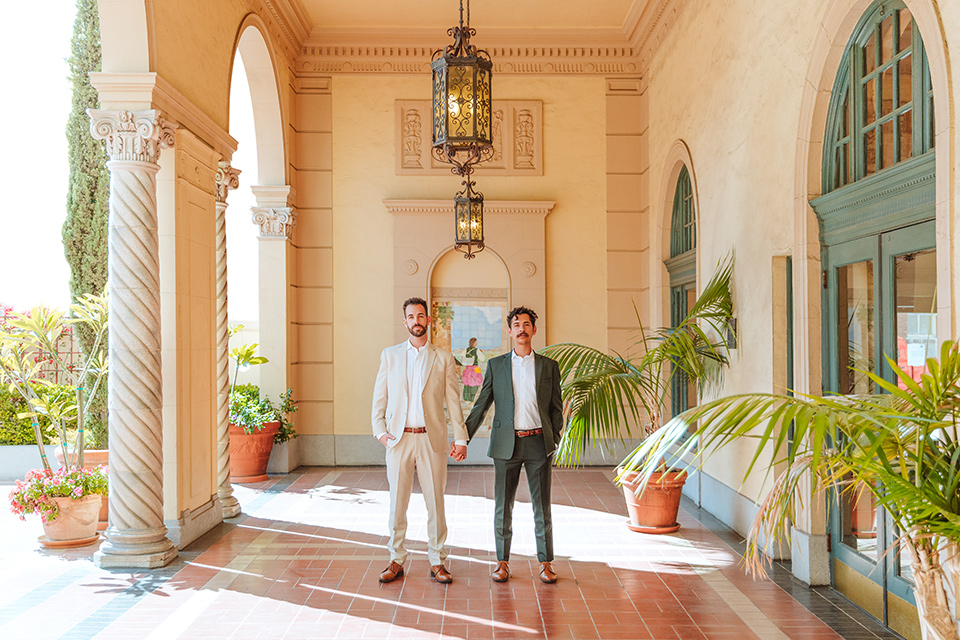  engagement shoot in long beach CA with one groom in a tan suit and the other groom in a green suit