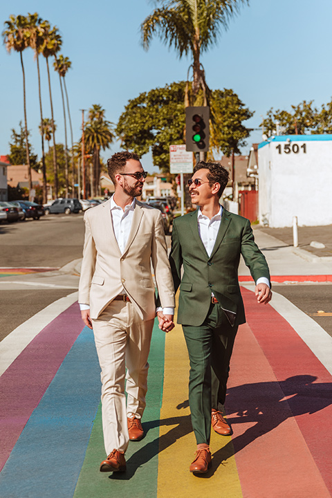  engagement shoot in long beach CA with one groom in a tan suit and the other groom in a green suit