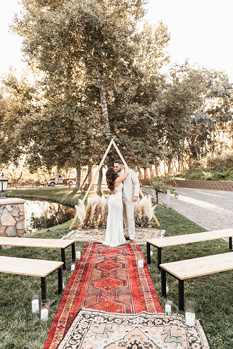  boho fall décor with rugs that are mix-matching as the aisle runner for the ceremony