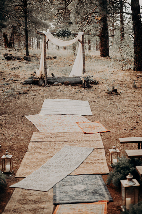  boho fall décor with rugs that are mix-matching as the aisle runner for the ceremony 