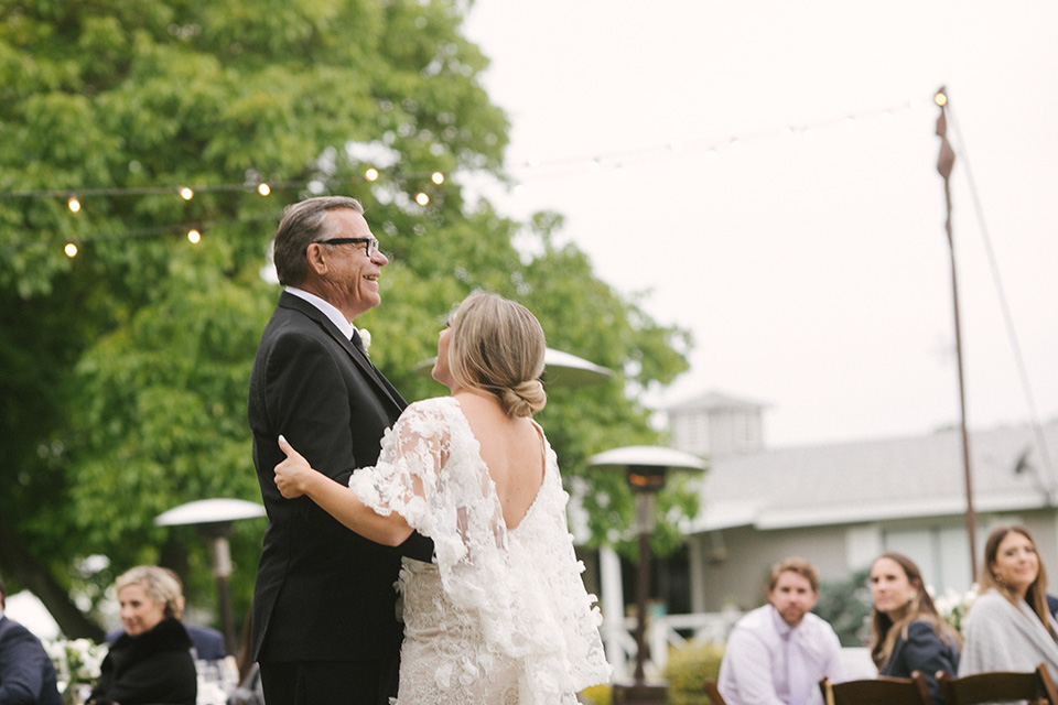  father of the bride in a black velvet tuxedo  