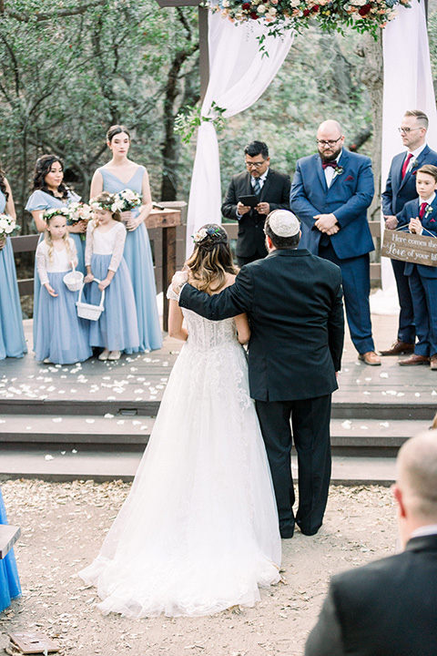  father of the bride in a black tuxedo