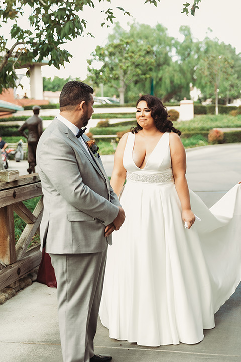 father of the bride in a light grey suit 