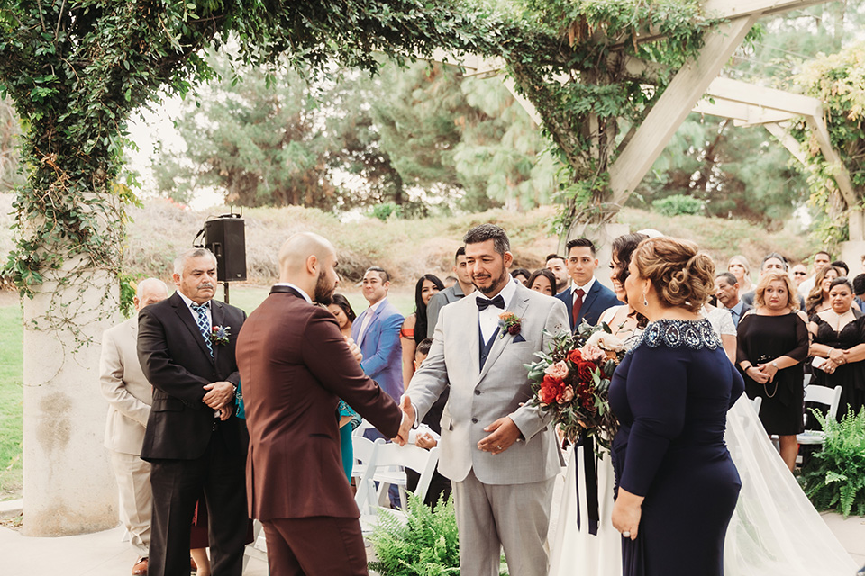  father of the bride in a light grey suit 