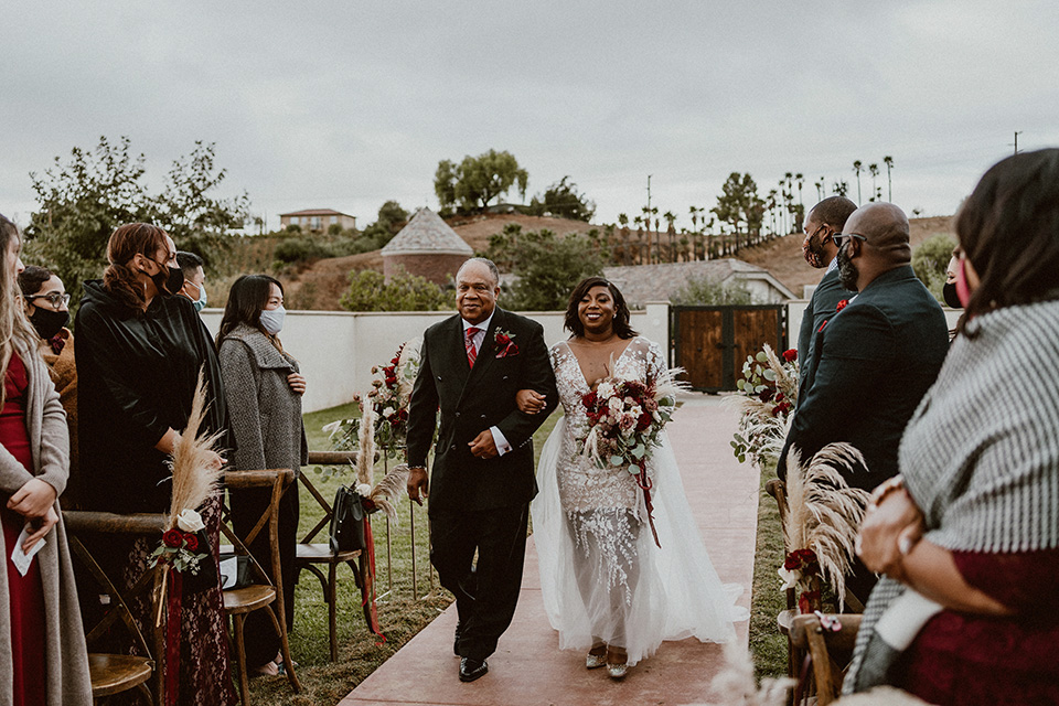  father of the bride in a black velvet tuxedo  