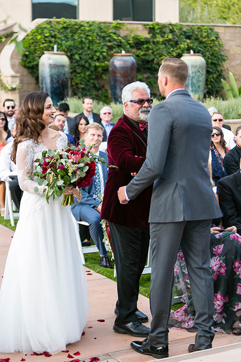 father of the bride in a light grey suit 