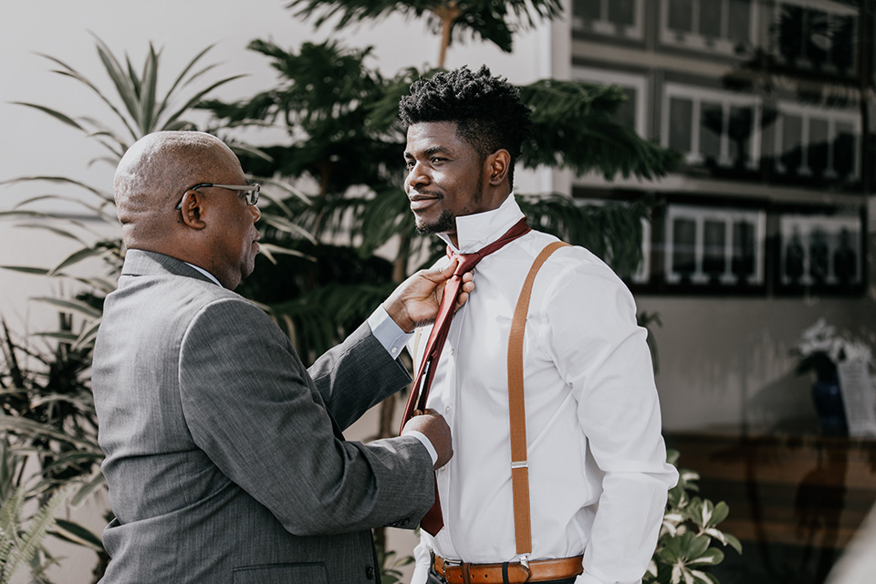  father of the bride in a black velvet tuxedo  