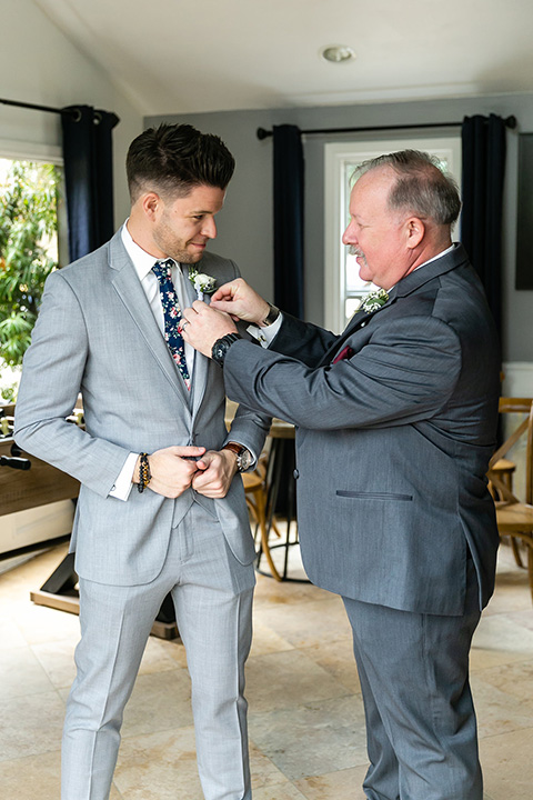  father of the bride in a light grey suit 