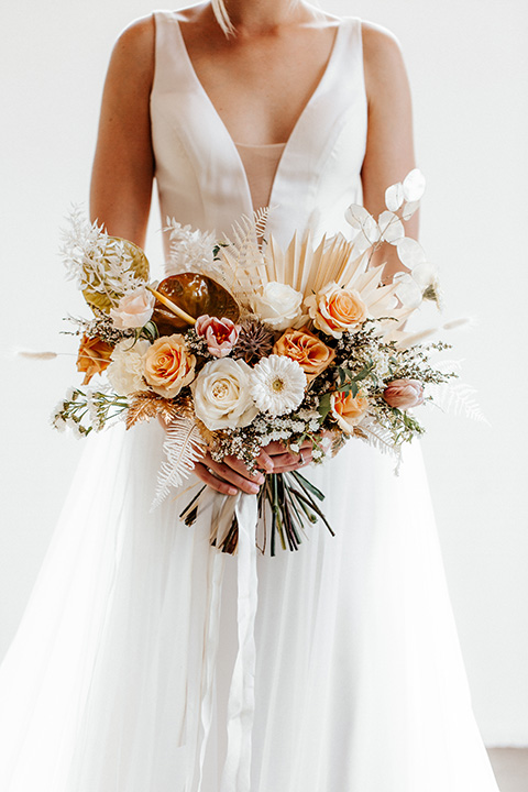  alleylujah neutral wedding – bride in a long tulle gown with a low cut back 