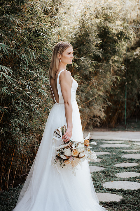  alleylujah neutral wedding – bride in a long tulle gown with a low cut back