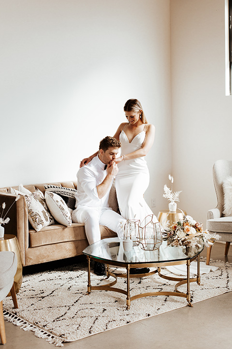  alleylujah neutral wedding – bride in a modern white gown and the groom in a white shawl lapel tuxedo