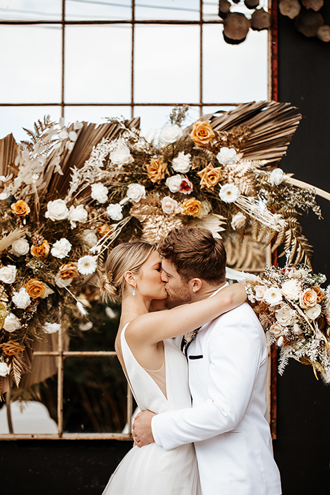  alleylujah neutral wedding – bride in a modern white gown and the groom in a white shawl lapel tuxedo