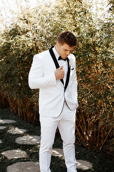  alleylujah neutral wedding – bride in a modern white gown and the groom in a white shawl lapel tuxedo 