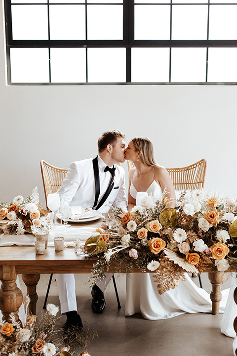  alleylujah neutral wedding – bride in a modern white gown and the groom in a white shawl lapel tuxedo 