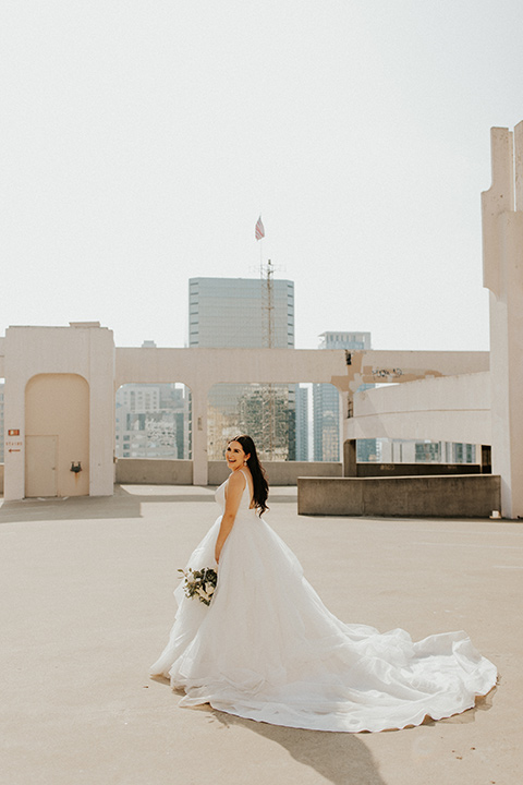  industrial wedding at the pannikin building in san diego with gold bridesmaids gowns and black tuxedos for the groom and groomsmen 