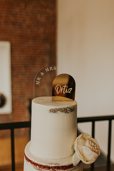  industrial wedding at the pannikin building in san diego with gold bridesmaids gowns and black tuxedos for the groom and groomsmen 