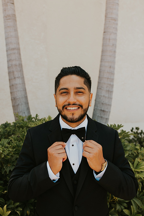  industrial wedding at the pannikin building in san diego with gold bridesmaids gowns and black tuxedos for the groom and groomsmen 