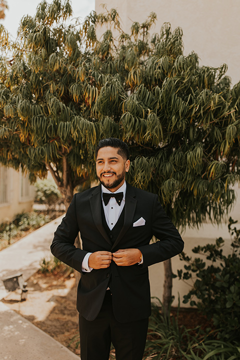  industrial wedding at the pannikin building in san diego with gold bridesmaids gowns and black tuxedos for the groom and groomsmen 