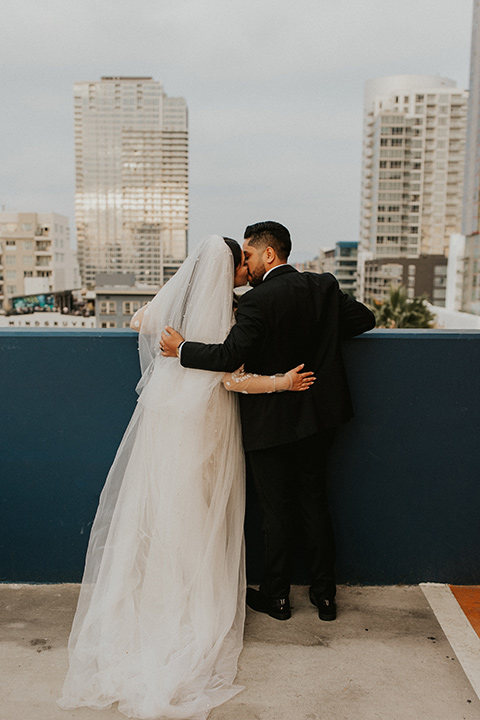  industrial wedding at the pannikin building in san diego with gold bridesmaids gowns and black tuxedos for the groom and groomsmen 