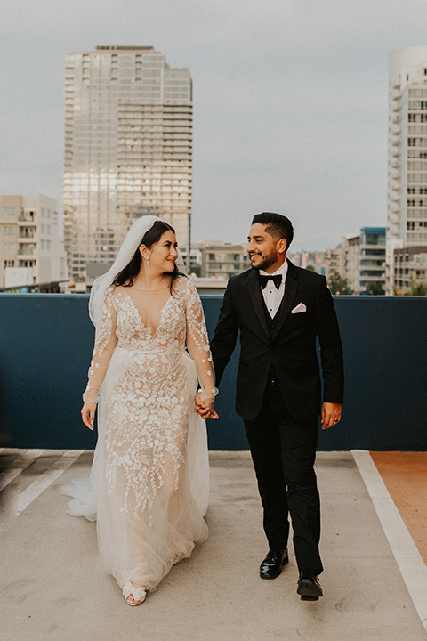  industrial wedding at the pannikin building in san diego with gold bridesmaids gowns and black tuxedos for the groom and groomsmen 