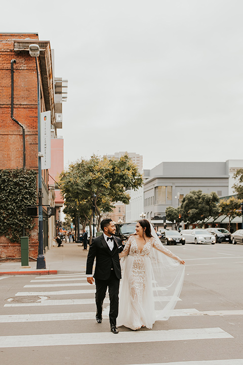  industrial wedding at the pannikin building in san diego with gold bridesmaids gowns and black tuxedos for the groom and groomsmen 