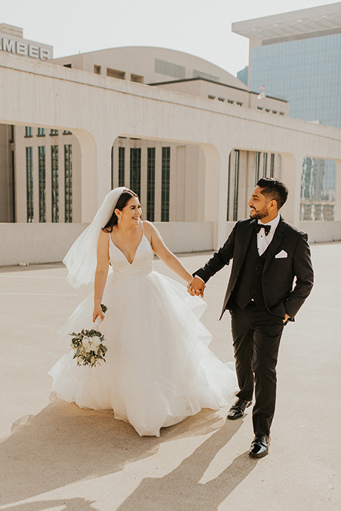  industrial wedding at the pannikin building in san diego with gold bridesmaids gowns and black tuxedos for the groom and groomsmen 