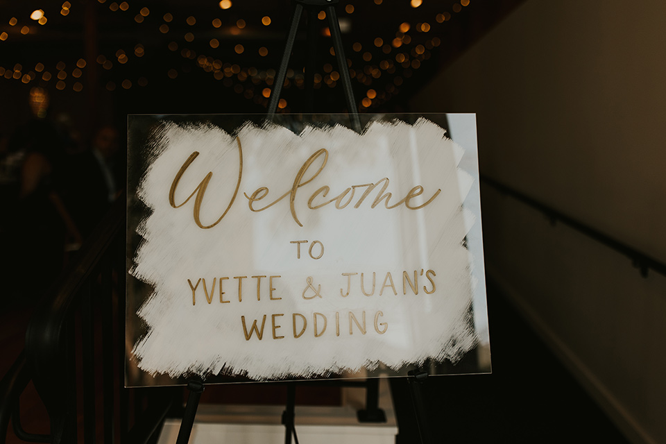  industrial wedding at the pannikin building in san diego with gold bridesmaids gowns and black tuxedos for the groom and groomsmen 