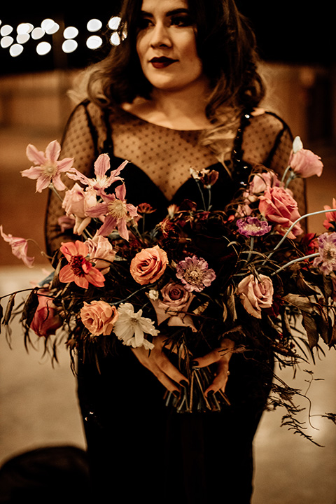  bride in a black bridal gown with a pin dot overlay 