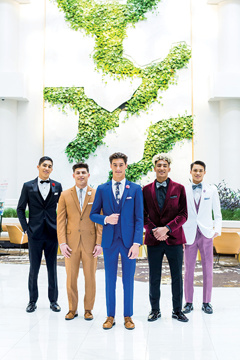  guys in all different colors of suits and tuxedos for homecoming