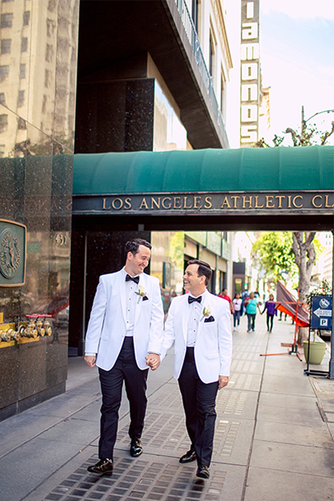  grooms in the same cobalt blue suit with 2 different color ties 