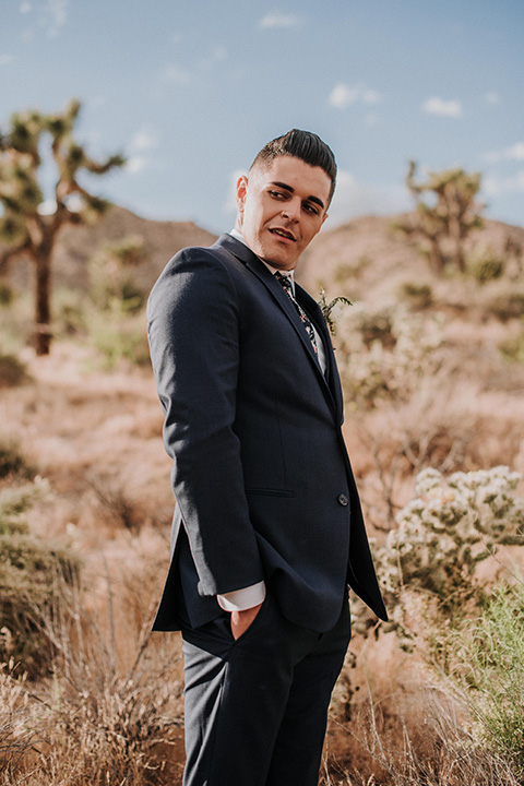  grooms in the same cobalt suit with 2 different color ties 