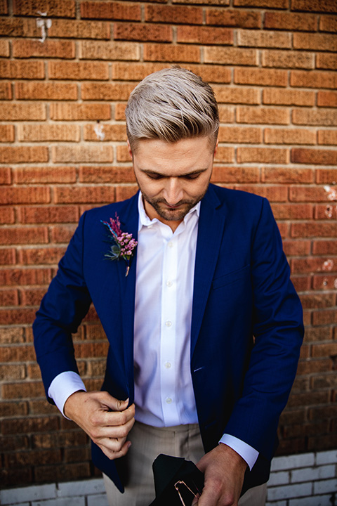  grooms in the same cobalt blue suit with 2 different color ties 