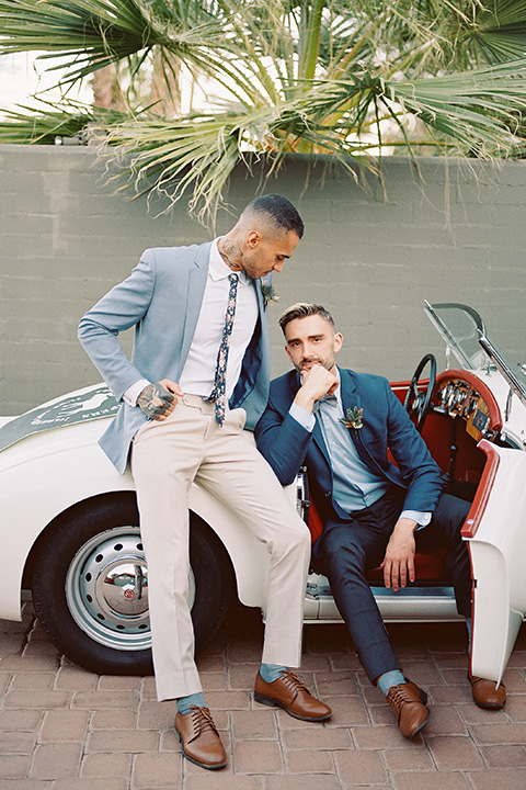  grooms in the same cobalt suit with 2 different color ties 